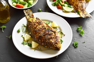 Roasted fish on plate