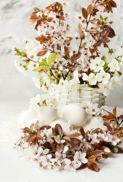 Easter still life. Gentle bright photo of egg and cherry blossoms.