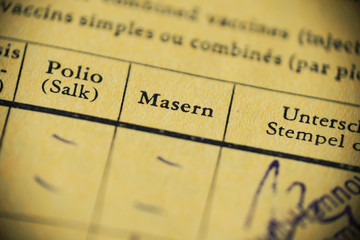 Masern is German for measles - international certificate of vaccination - anti-vaccination concept