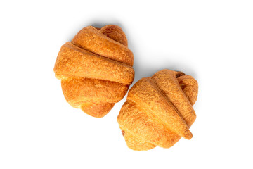 Croissant with condensed milk isolated on white background.