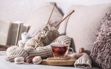 vintage knitting needles and yarn with a Cup of tea