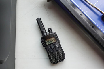 Portable black radio transmitter lying on the table