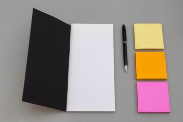 Business copy space with luxury notebook, pen and multicolored sticky notes