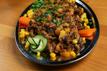 Close up of delicious food on wooden table.