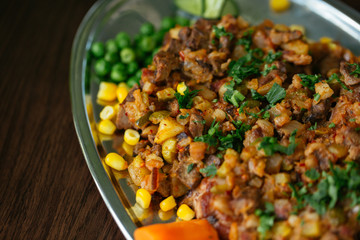 Close up of delicious food on brown table.