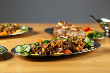 Close up of delicious food on wooden table.
