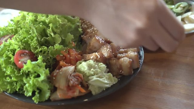 Korean bossam steamed pork belly ribs and side dishes serve in restuarant