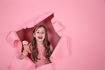 Fototapeta premium funny little girl with ice cream on colored background