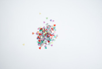 colored Sequin scattered on white background