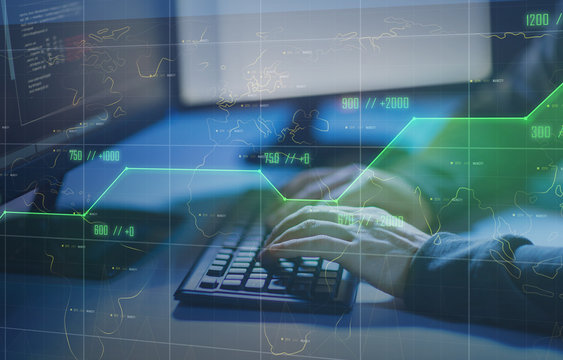 cybercrime, hacking and technology concept - hands of hacker in dark room writing code or using computer virus program for cyber attack