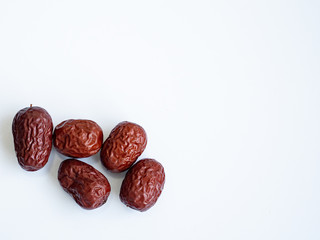 Red dried Jujubes isolated in white background, health food