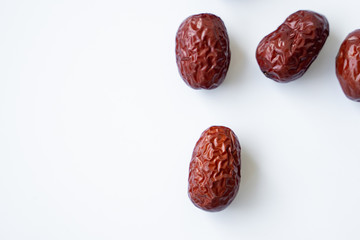 Red dried Jujubes isolated in white background, health food