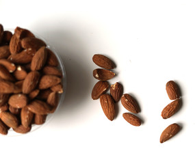 Healthy food  for background image close up almond nuts. Texture on white grey table top view