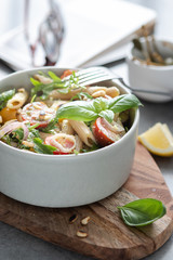 Salad - penne pasta with tomatoes, pesto, basil and lemon