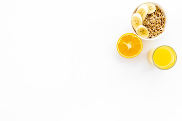 food for healthy breakfast with granola and fresh orange juice on bright white background top view mock up