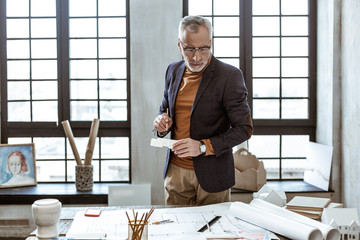 Interior designer planning the apartment in light workshop