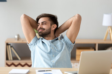 Satisfied student, businessman relaxing leaning back after finish work