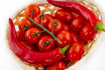 background vegetable red tomato cherry a lot of fruits on a branch of a couple of hot peppers mix sauce