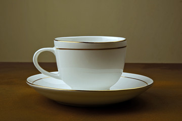 cup of coffee on wooden background