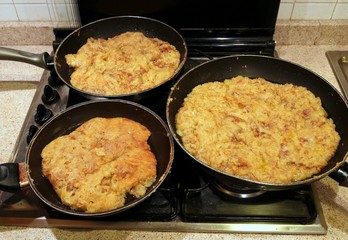 three pots of Frico an italian food of Friuli Region in Italy ma