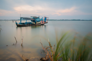 Fototapeta premium Long exposure, Decayed ship in the sea