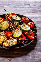 Pepper stuffed with groats and vegetables and grilled chicken strips