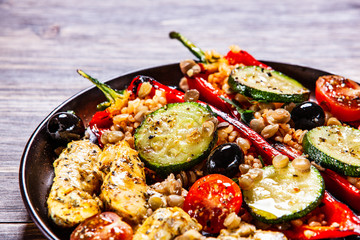 Pepper stuffed with groats and vegetables and grilled chicken strips