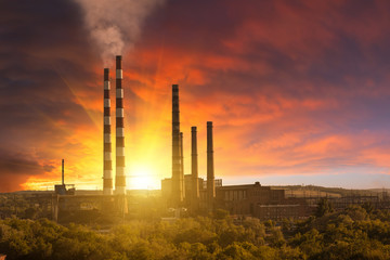 Fototapeta na wymiar Industrial landscape with smoke from pipes