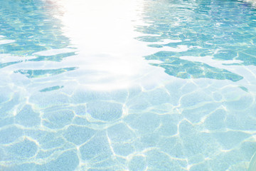 Fototapeta na wymiar Textured blue water in the pool