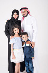 Arab family standing together and smiling