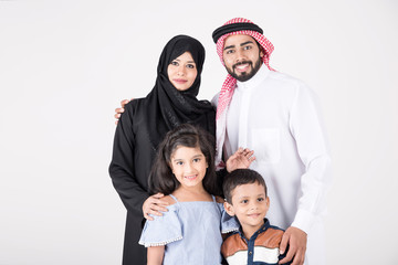 Arab family standing together and smiling