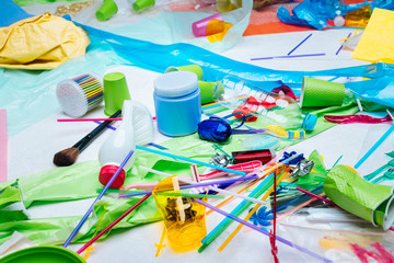 Plastic items harming and polluting nature lying on the floor