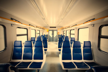 Rows of seats in a passenger train carriage
