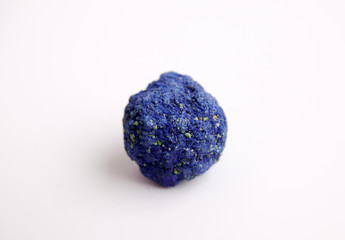 Macro mineral stone Azurite in siltstone against white background close up