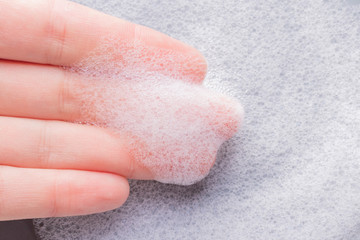 Foam on hand with bubbles