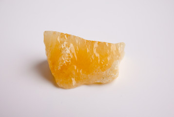 macro photography of natural mineral from geological collection - raw yellow calcite stone
