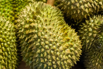 green large spiked fruit close-up strongly smelly market thailand seasonal market