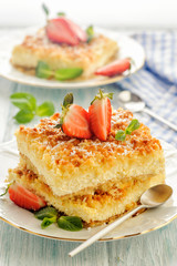 Bright sunny rustic pie with cottage cheese cooked. Fresh with strawberries and mint. Vertical view.
