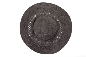 Pretty straw hat with ribbon and bow on white background. Beach hat top view isolated