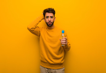 Young man worried and overwhelmed