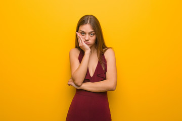 Obraz premium Young elegant woman wearing a dress tired and very sleepy