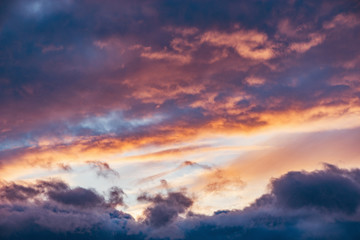 Naklejka na ściany i meble Amazing cloudscape on the sky at sunset time after rain.