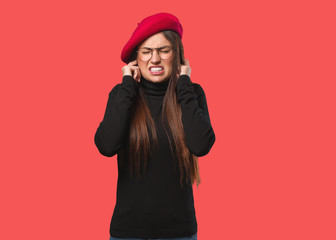 Young artist woman covering ears with hands