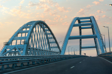Crimean bridge over the black and Azov seas to the city of Kerch at sunset in summer