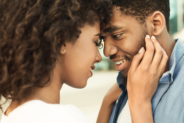 Enjoy moment. Tender couple touching foreheads on date