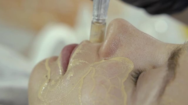 Cheek girls closeup. It hammered microinjection of Foundation.