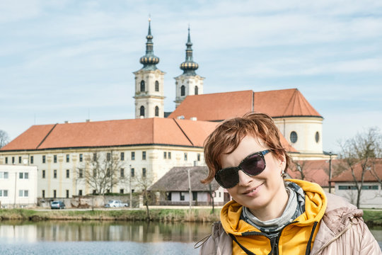 Tourist woman with Basilica minor in Sastin-Straze, Slovakia
