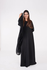 Naklejka premium Beautiful Arab woman in traditional dress dancing