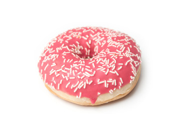 Closeup of pink doughnut on white background