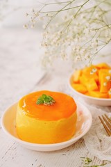 Mango Mousse with sliced ripe mangoes on side, selective focus